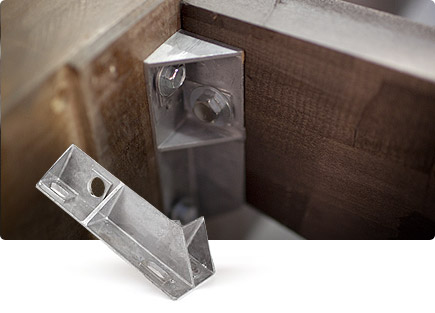 A frame comprised of doubled centre and cross beams and moulded metal brackets for extra support and stability